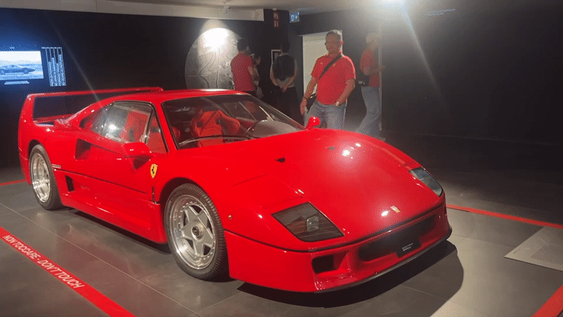 Visitors document Ferrari displays during Maranello facility tour