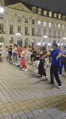 Synchronized dance session fills Place Vendôme at night