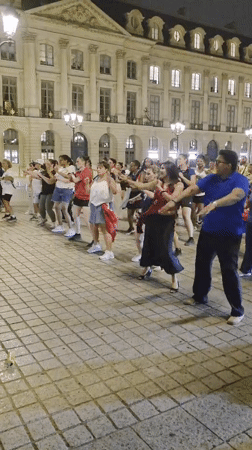 Synchronized dance session fills Place Vendôme at night