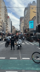 March with Lebanese flags passes vendors in Buenos Aires