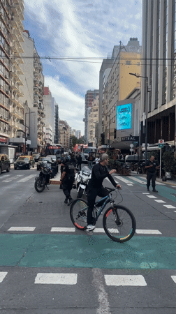 March with Lebanese flags passes vendors in Buenos Aires
