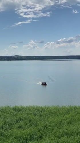 Summer hangout at a lakeside wooden deck in Votkinsk