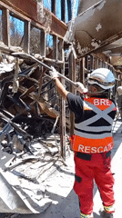 Rescue crews clear fire debris in Concepción, Chile