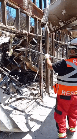 Rescue crews clear fire debris in Concepción, Chile