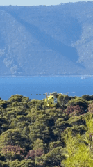 Helicopter passes over Adriatic coast near Makarska