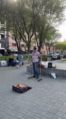 Street musician plays bottle instruments in Yerevan square