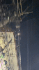 Dense overhead wire network captured in Pattaya night scene