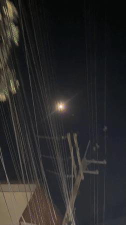 Dense overhead wire network captured in Pattaya night scene