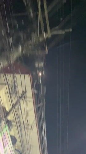 Dense overhead wire network captured in Pattaya night scene