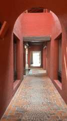 Video captures movement through historic terracotta hallway in Puebla