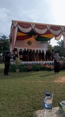 Indonesian students perform traditional dances at school graduation ceremony