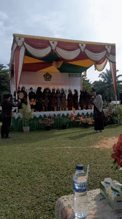 Indonesian students perform traditional dances at school graduation ceremony