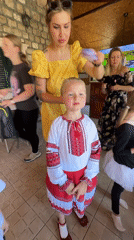 Girl in traditional dress observed indoors in Đenovići, Montenegro