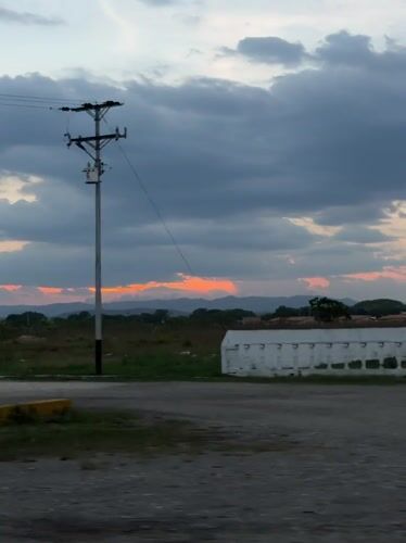 Dusk landscape filmed from moving vehicle in Tinaquillo, Venezuela