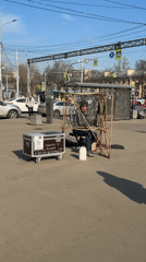 Street musician performs with glass bottles in Sankt-Peterburg