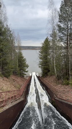 Dam spillways actively discharge water in Chernushka, Russia