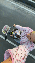 Bicycle ride with a child, evening snapshot from rural Russia
