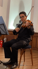 Violinist performs near Museo Nacionales in Buenos Aires
