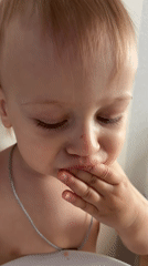 Toddler enjoys breakfast sandwich in Moscow suburb