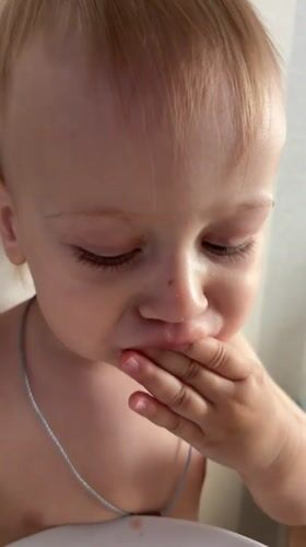 Toddler enjoys breakfast sandwich in Moscow suburb