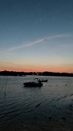 Dusk waterfront scenes captured along Badem India boardwalk