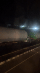 Industrial tank transported by truck in Khandala at night