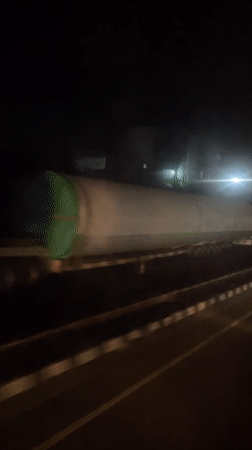 Industrial tank transported by truck in Khandala at night