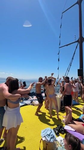 Young adults enjoy sunny boat party off Menderes coast