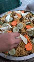 Morning biryani preparation documented during backyard rainfall session