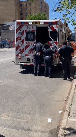 Police officers investigate at FDNY ambulance scene in NYC