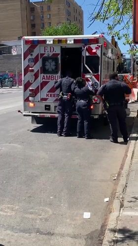 Police officers investigate at FDNY ambulance scene in NYC