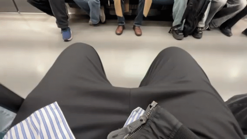 Commuters use phones on Tokyo subway during Saturday morning