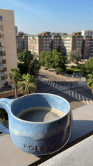 Morning coffee ritual captured from Valencia balcony overlook