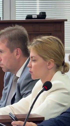 Formal proceedings underway at a table in Kyiv