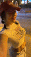 Woman records selfie video while walking in Barcelona at night
