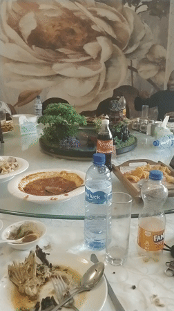 Post-meal dining scene documented at Nigerian restaurant
