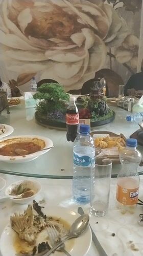 Post-meal dining scene documented at Nigerian restaurant