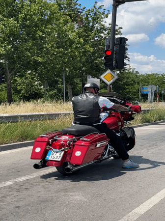 Red touring bike rolls through Veliko Tarnovo on a summer morning
