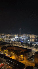 Nighttime views captured of Barcelona port area from elevated positions