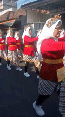 Traditional procession with matching red, gold, and white attire
