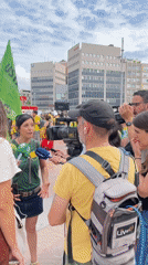 Yellow-shirted demonstrators gather near Barcelona's Palau Nacional amid police presence