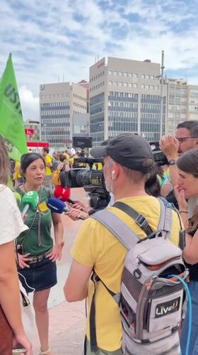 Yellow-shirted demonstrators gather near Barcelona's Palau Nacional amid police presence