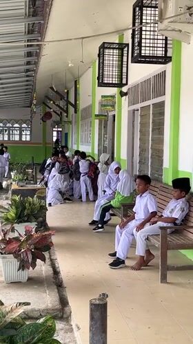 Students practice martial arts at Indonesian school courtyard