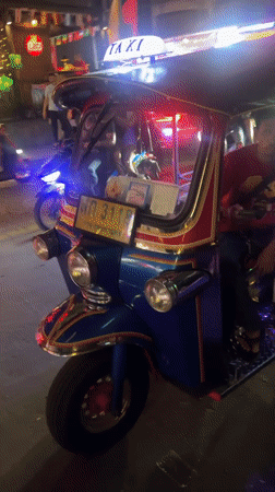 Illuminated tuk-tuk taxi spotted on Bangkok street