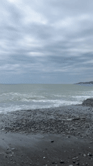 Cloudy day captured at Sochi beach with gentle waves