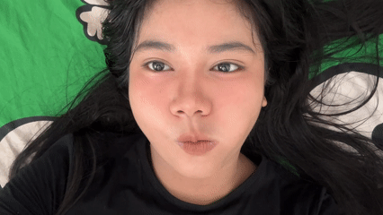 Woman and white cat share quiet moments in North Jakarta