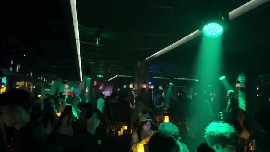 Crowded nightclub scene captured in Liangjiang, China