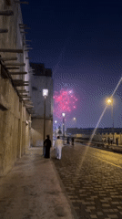 Fireworks display captured on Dubai cobblestone street