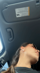 Woman drives through Schertz wearing sunglasses at night