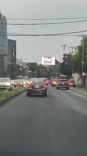 Wet road traffic documented in Mexico City overnight